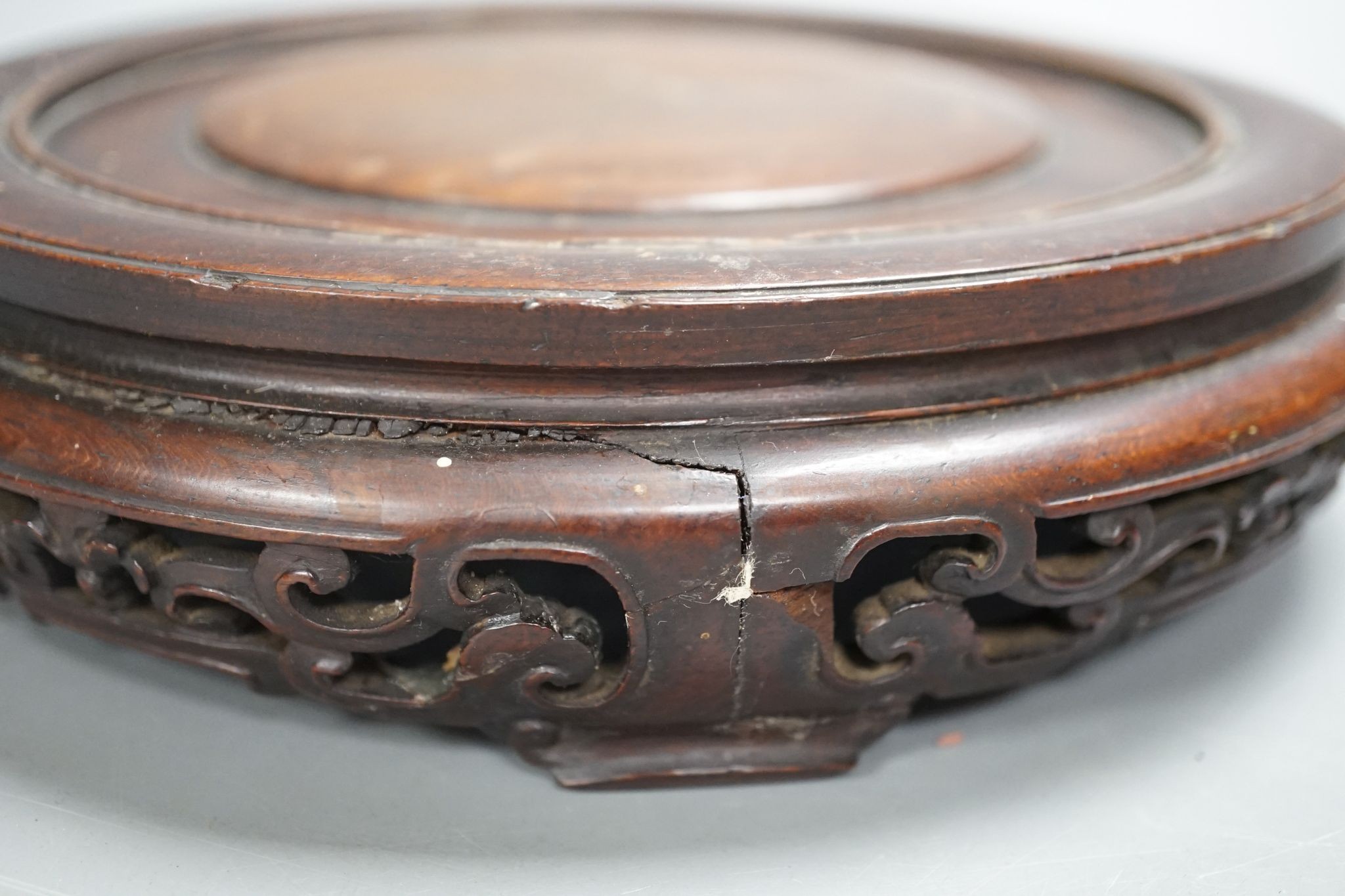 A Chinese carved hardwood stand 19cm